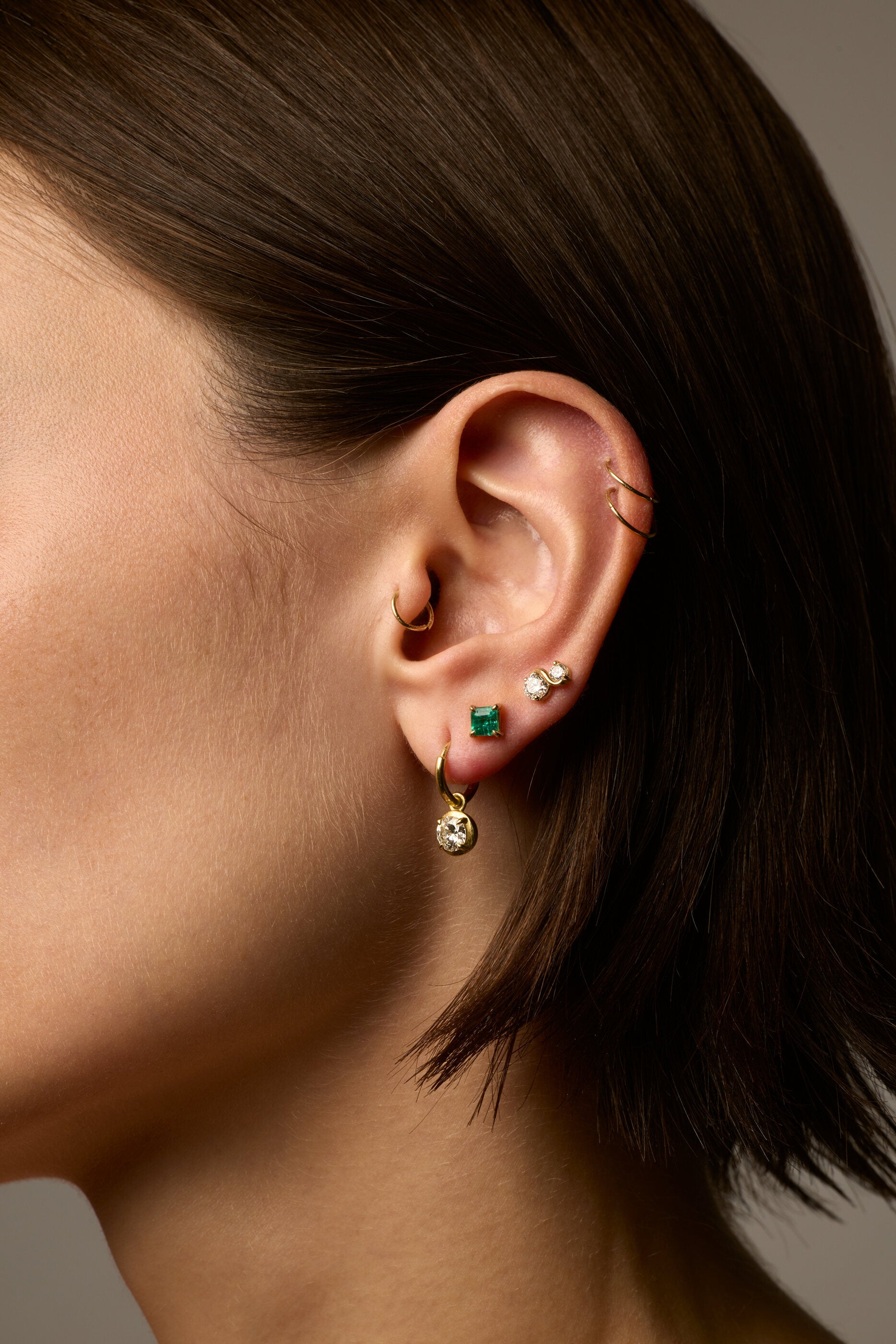 Gold earrings, worn